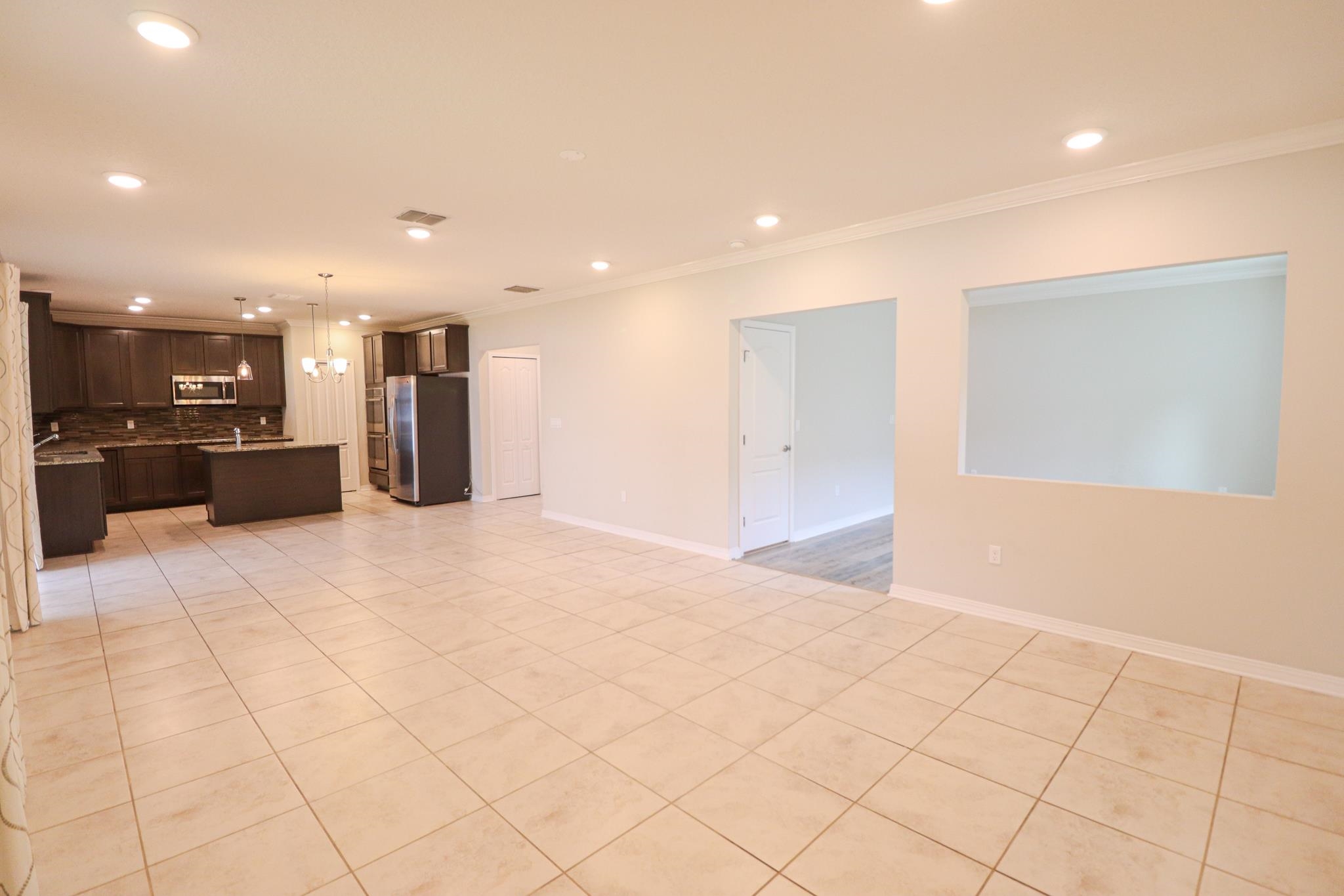 554 Tumbled Stone Way St. Augustine, FL 32086 - Photo 8 of 44 a view of a kitchen with a sink