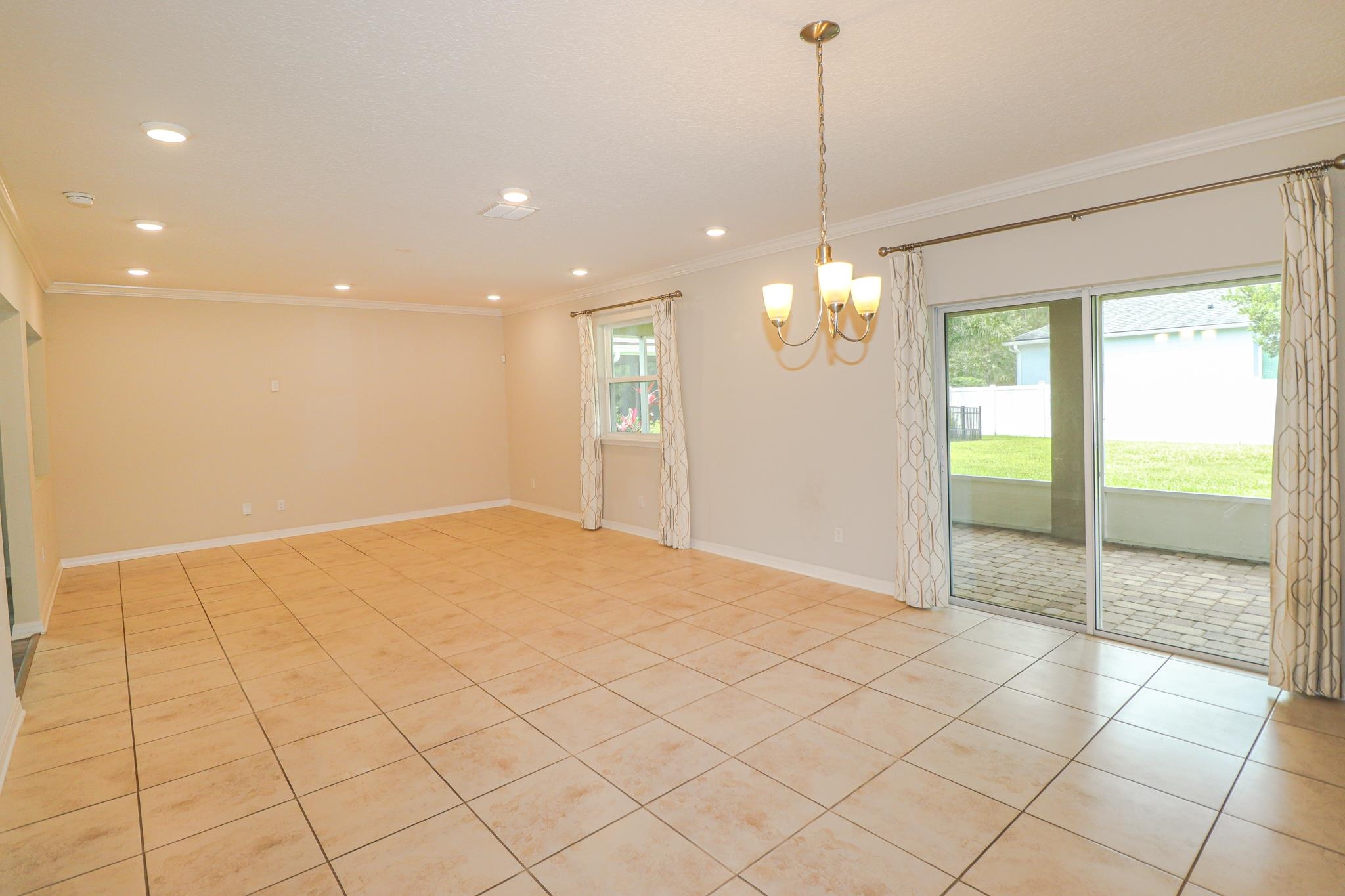 554 Tumbled Stone Way St. Augustine, FL 32086 - Photo 10 of 44 a view of an empty room and window