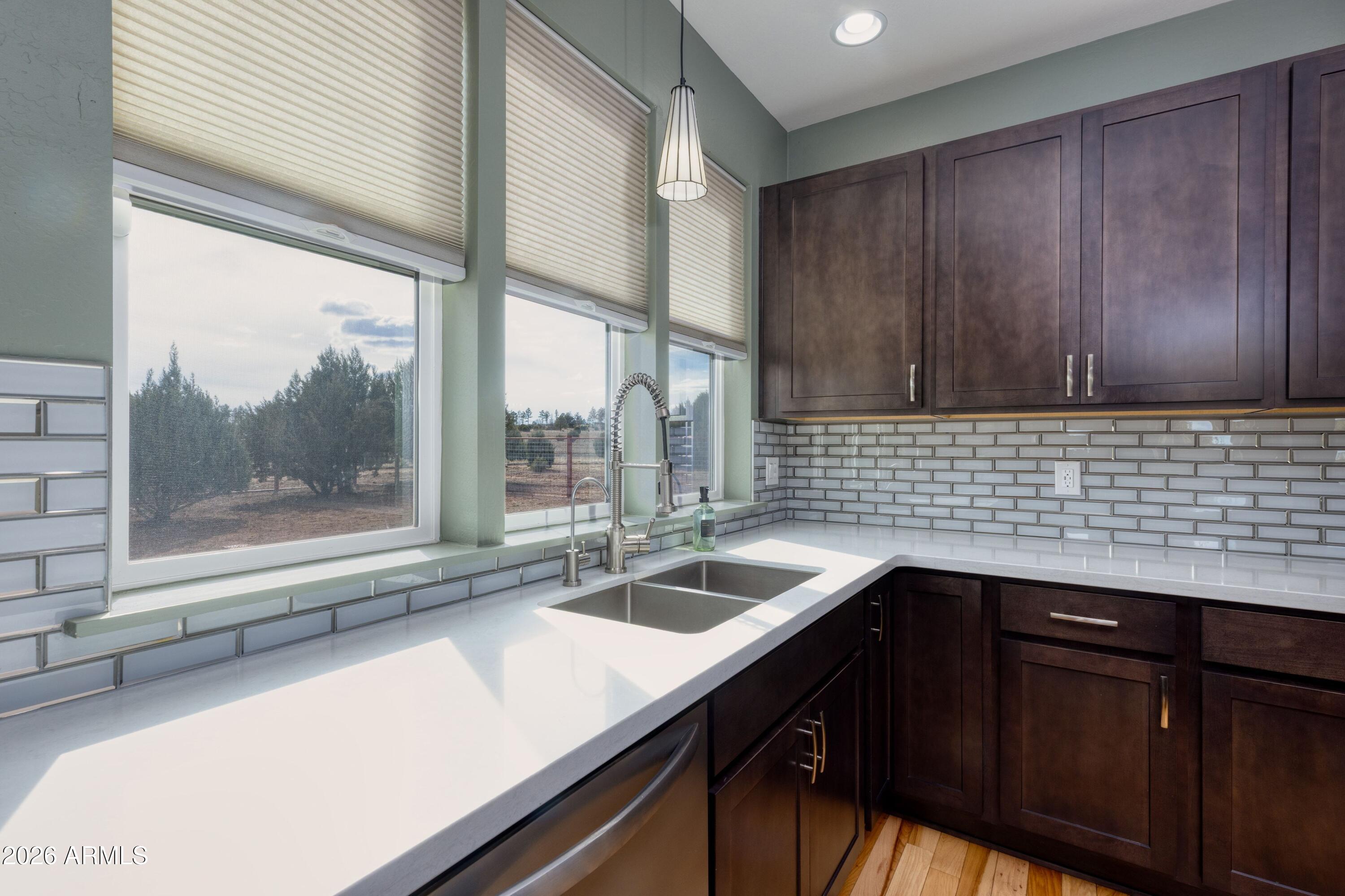1898 Rocky Lane Show Low, AZ 85901 - Photo 19 of 59 a kitchen with a sink and large window