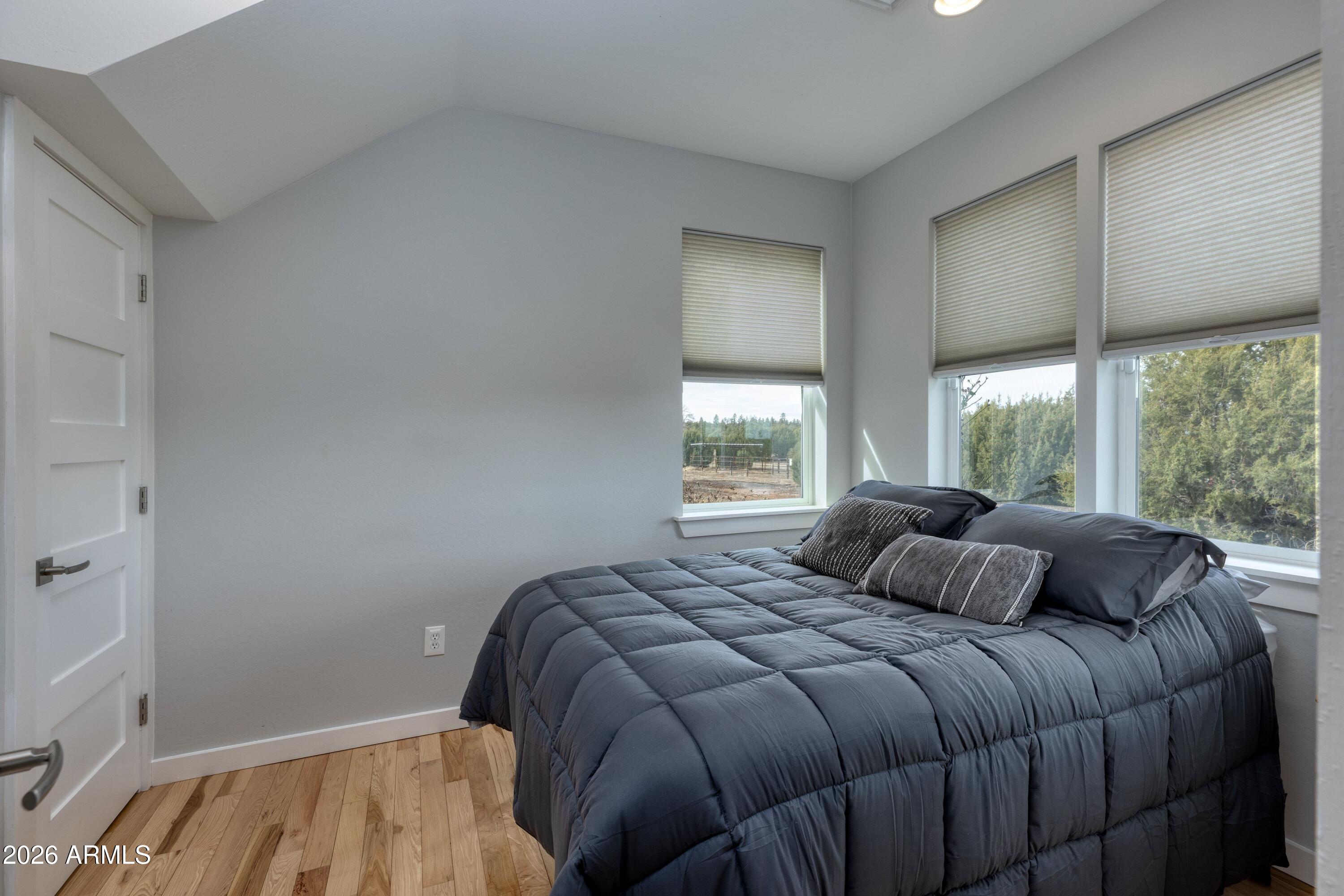 1898 Rocky Lane Show Low, AZ 85901 - Photo 23 of 59 a bedroom with a bed and a window