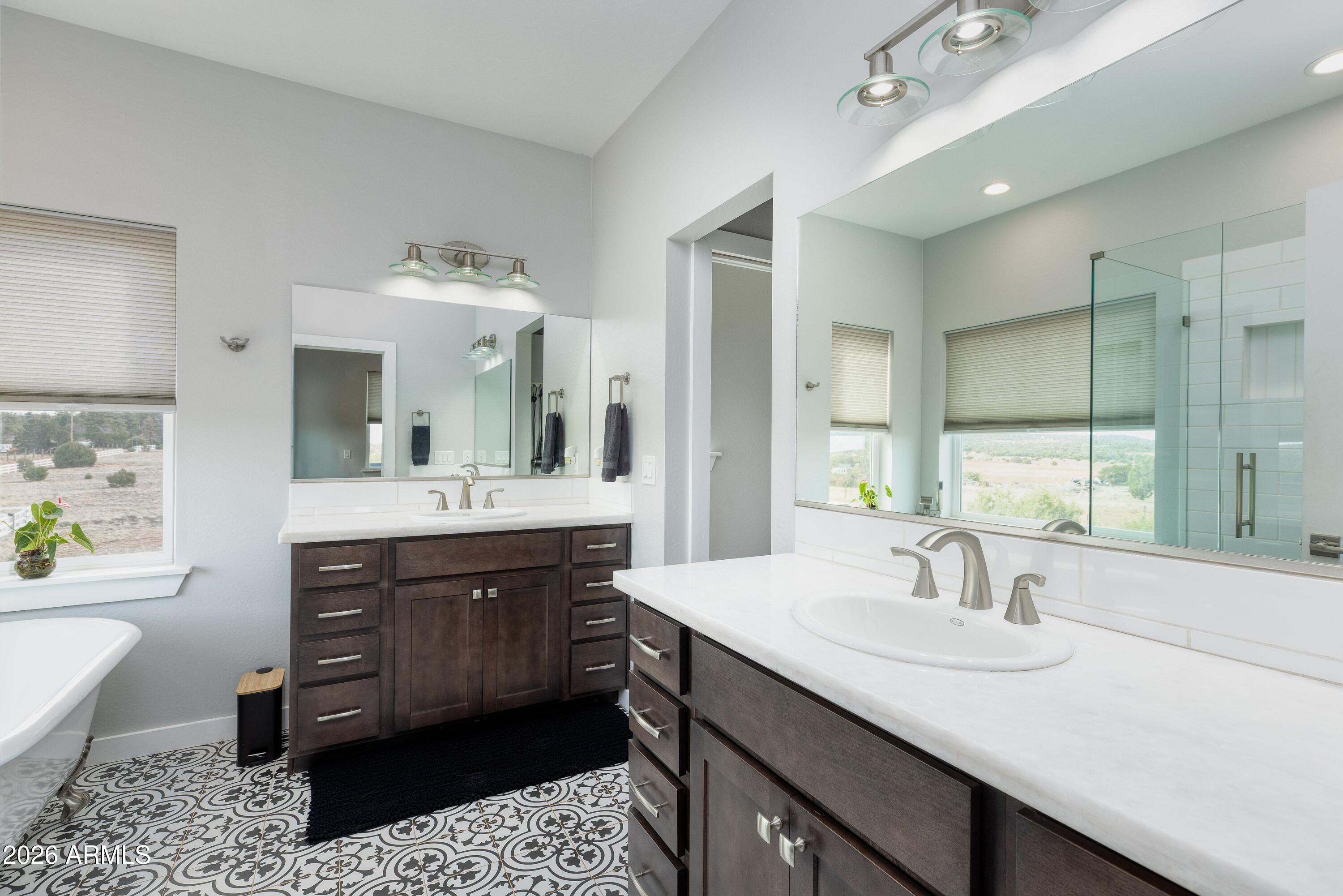 1898 Rocky Lane Show Low, AZ 85901 - Photo 30 of 59 a bathroom with a sink double vanity and a bathtub