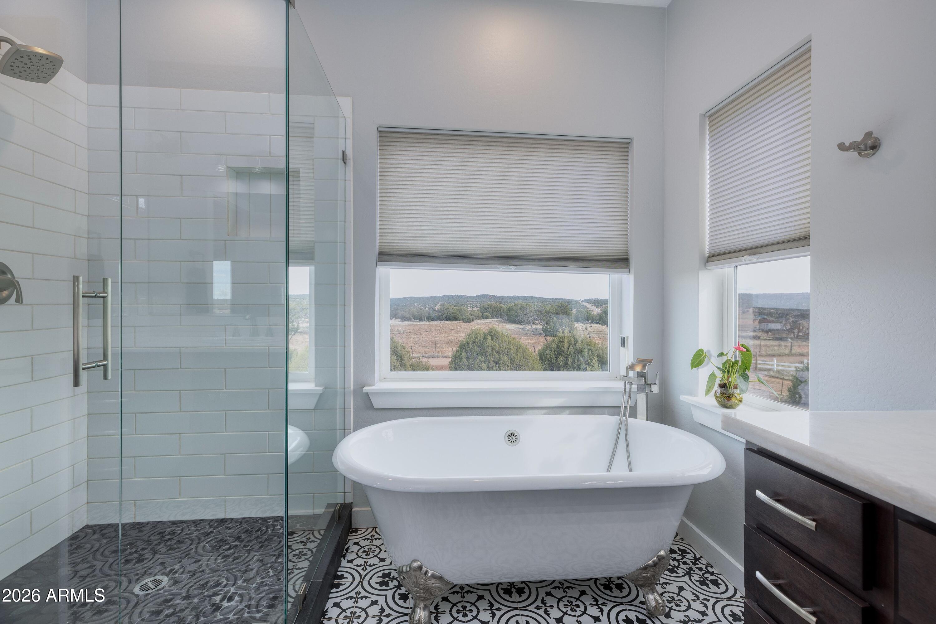 1898 Rocky Lane Show Low, AZ 85901 - Photo 31 of 59 a bathroom with a bathtub and a shower