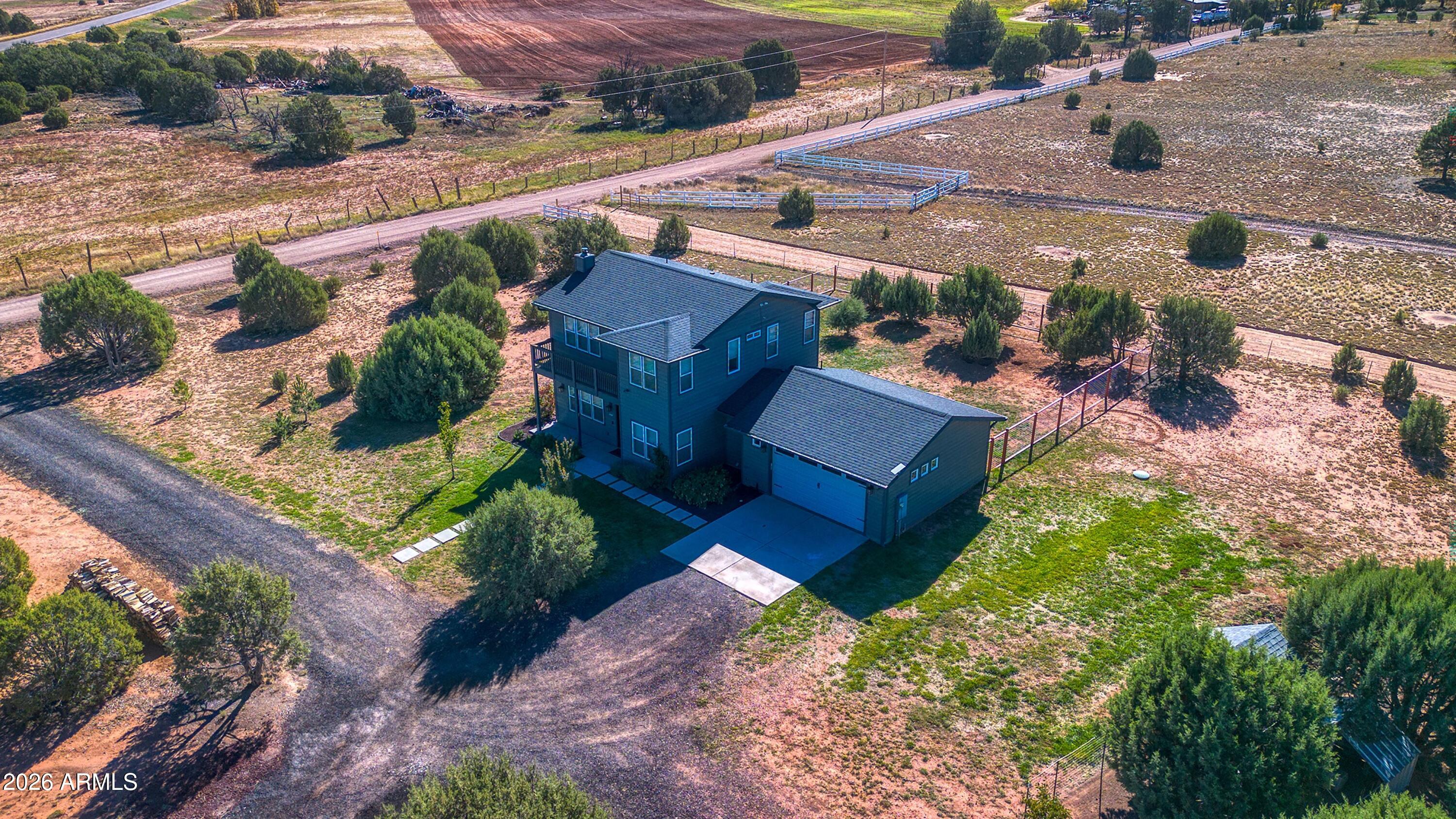 1898 Rocky Lane Show Low, AZ 85901 - Photo 42 of 59 an aerial view of a house with yard swimming pool and outdoor seating