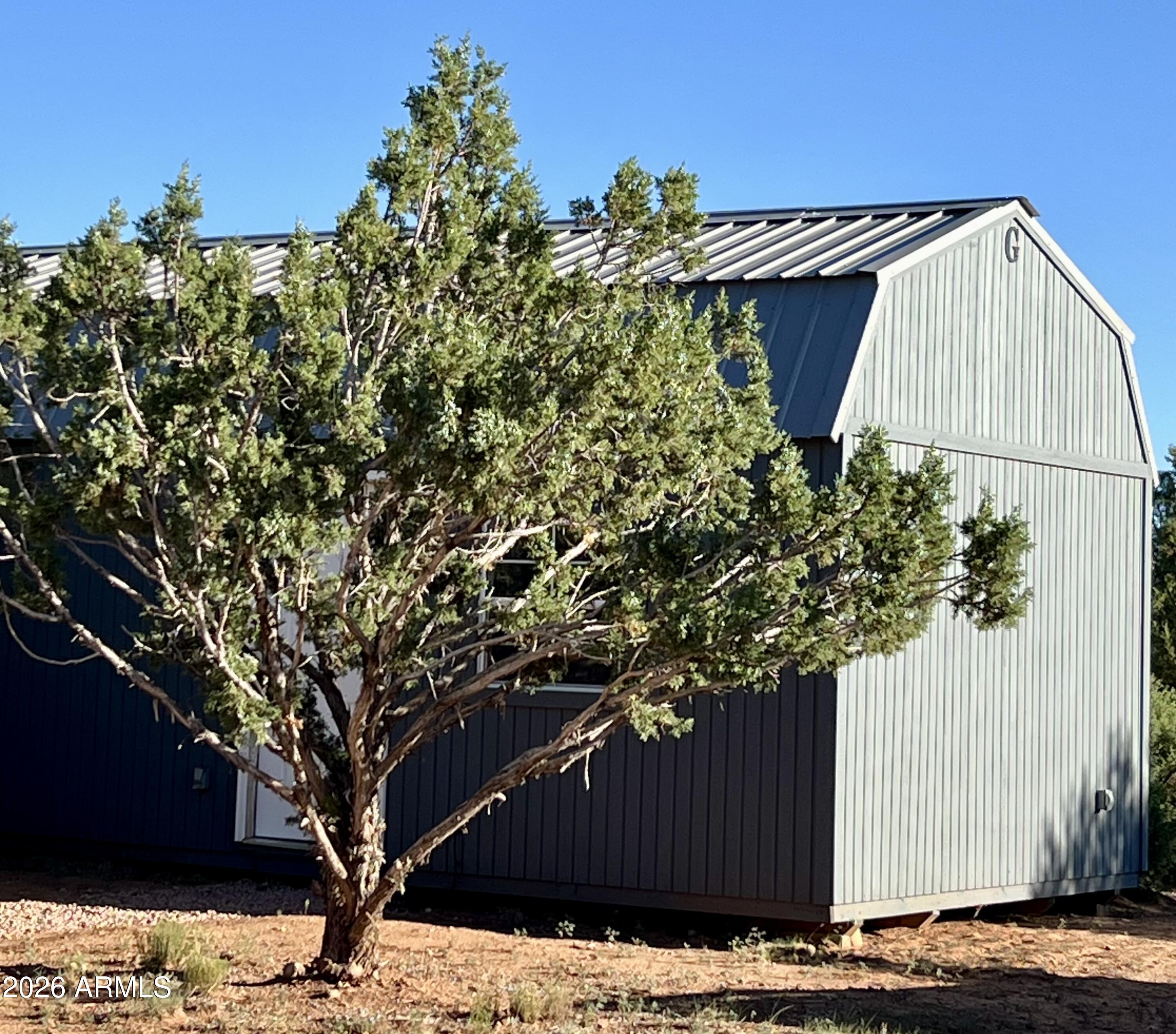 1898 Rocky Lane Show Low, AZ 85901 - Photo 57 of 59 a view of a house with a tree