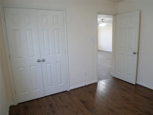 a view of room with hardwood floor