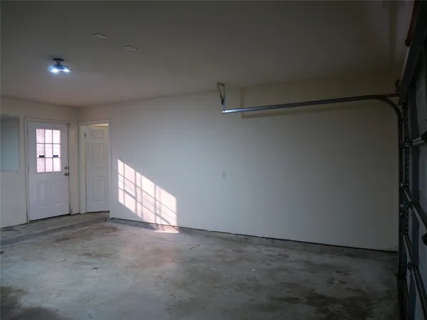 a view of an empty room and a window