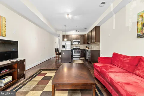 a bedroom with a bed and a table