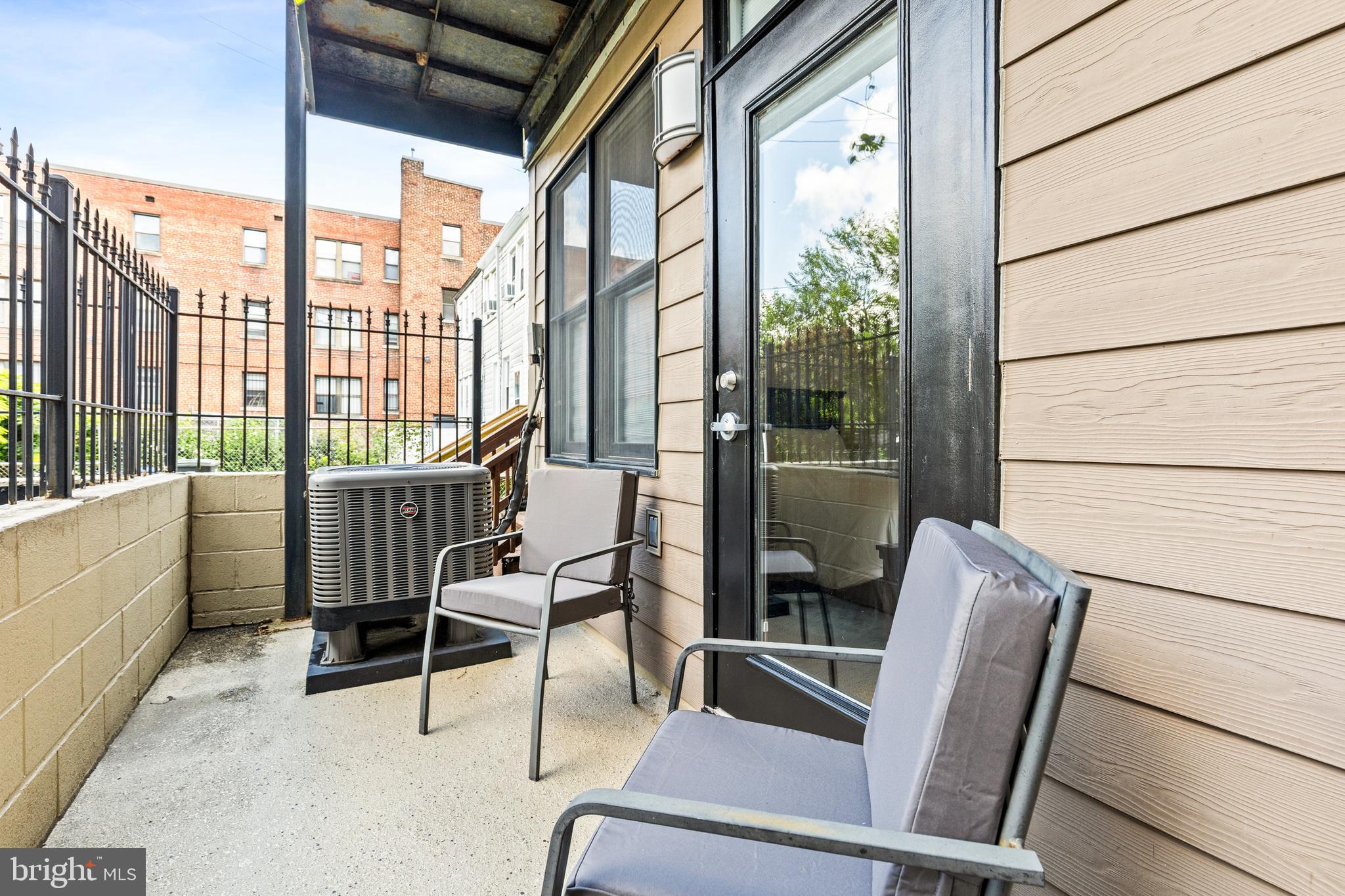 245 15th Street Southeast, Unit 105 Washington, DC 20003 - Photo 19 of 29 a view of a chairs and table in the balcony