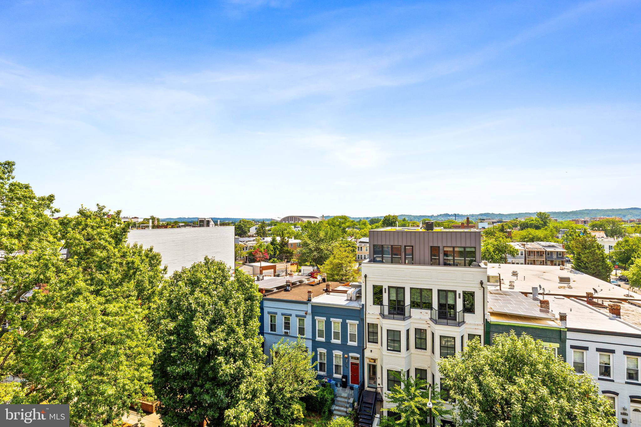 245 15th Street Southeast, Unit 105 Washington, DC 20003 - Photo 22 of 29 a view of a tall building with a lake view