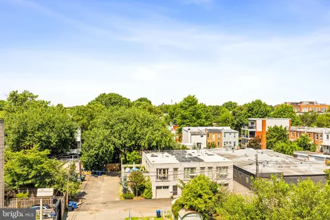 a flower garden is sitting in front of a building