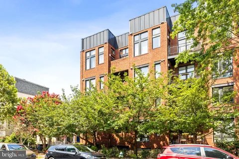 a view of a building with a street