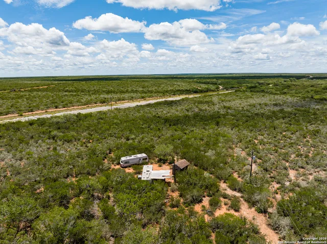 a view of a yard with an outdoor space