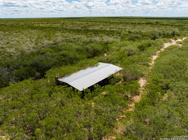 a view of outdoor space with playground and green space