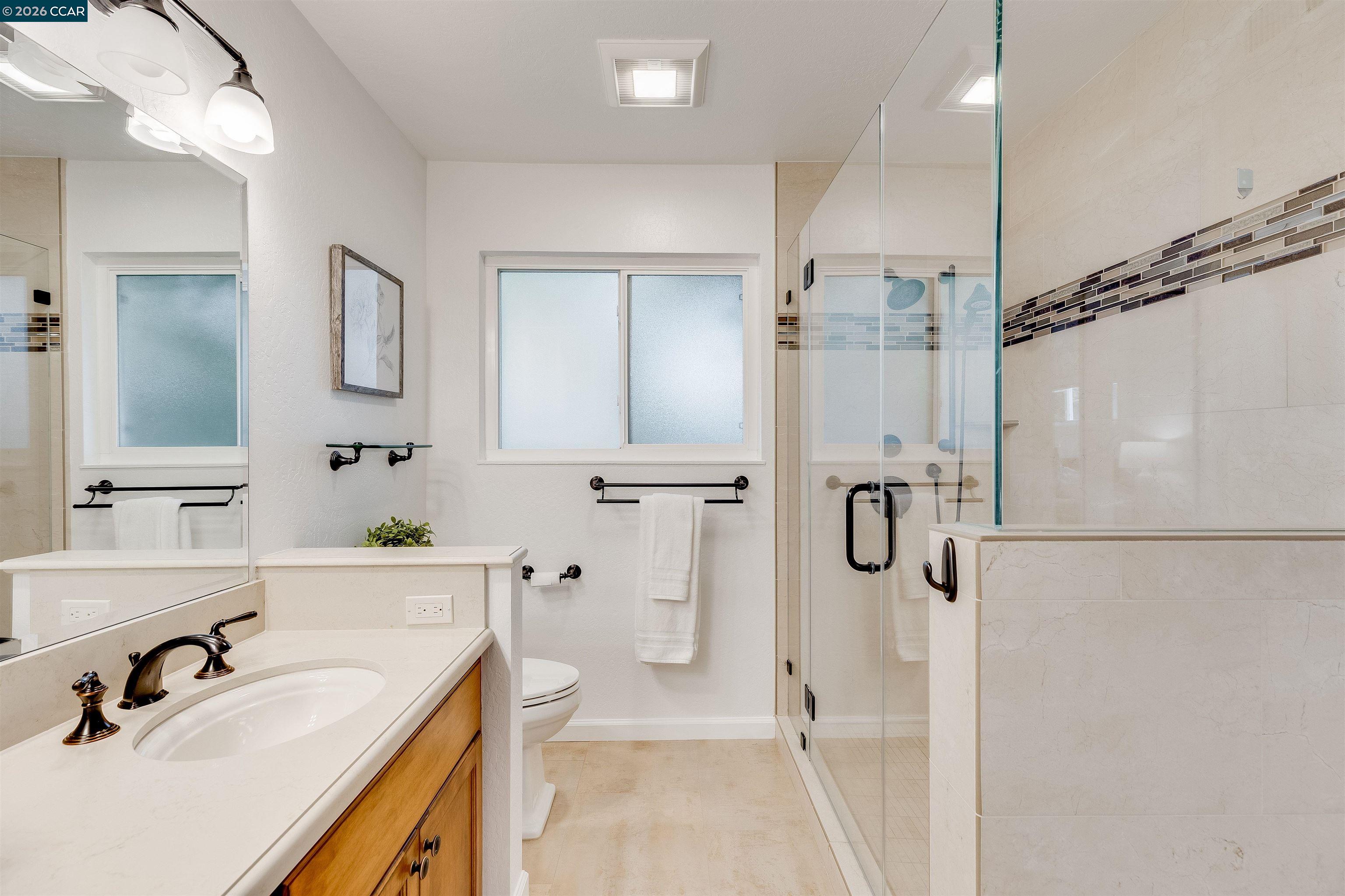418 Devon Court San Ramon, CA 94583 - Photo 37 of 62 a bathroom with a sink vanity granite tub shower and mirror