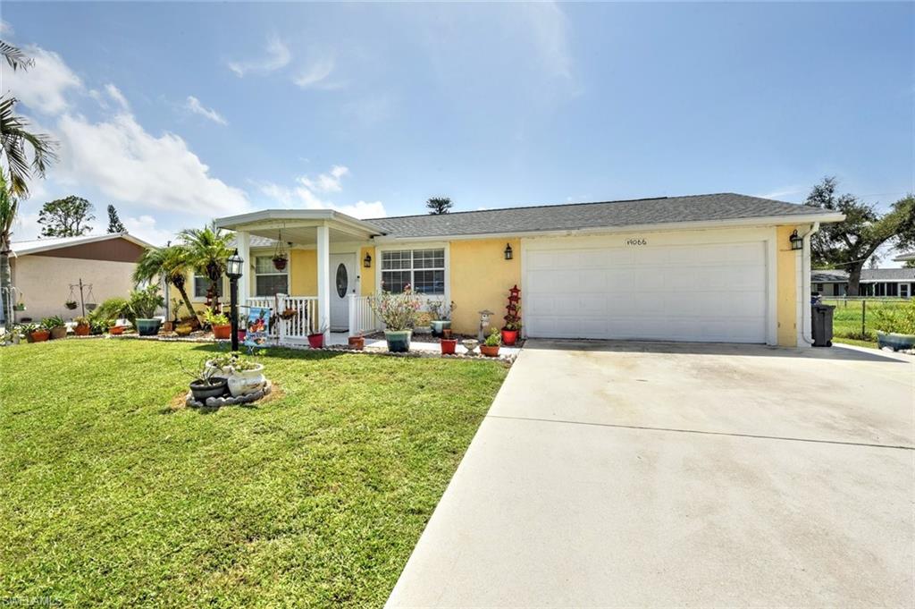 19066 Flamingo Road Fort Myers, FL 33967 - Photo 1 of 29 a view of a house with backyard porch and garden
