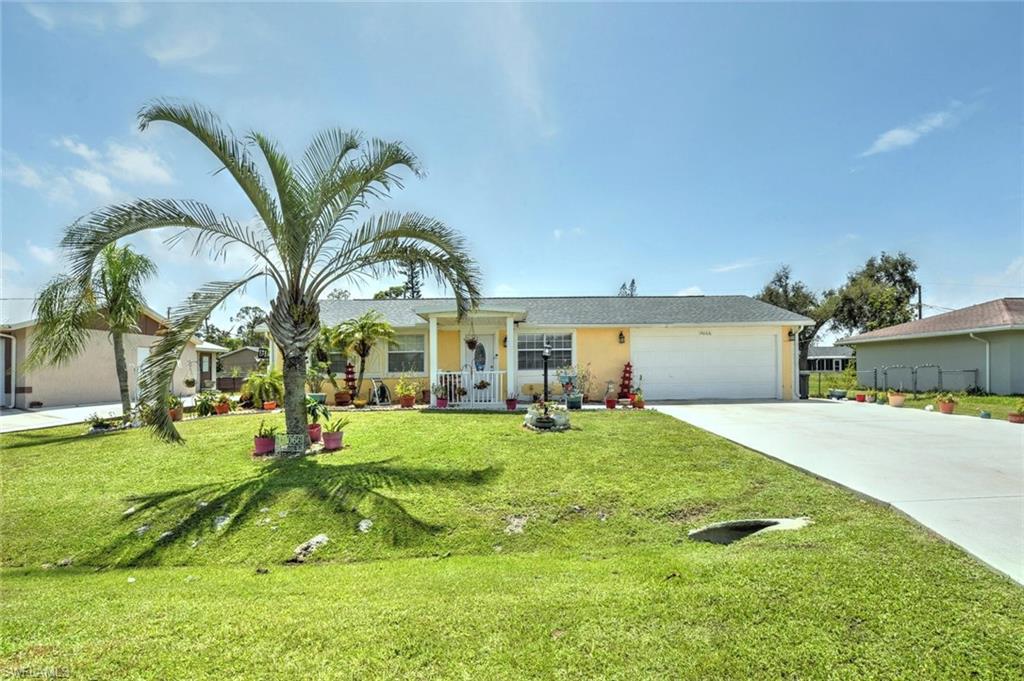 19066 Flamingo Road Fort Myers, FL 33967 - Photo 2 of 29 a house view with a garden space