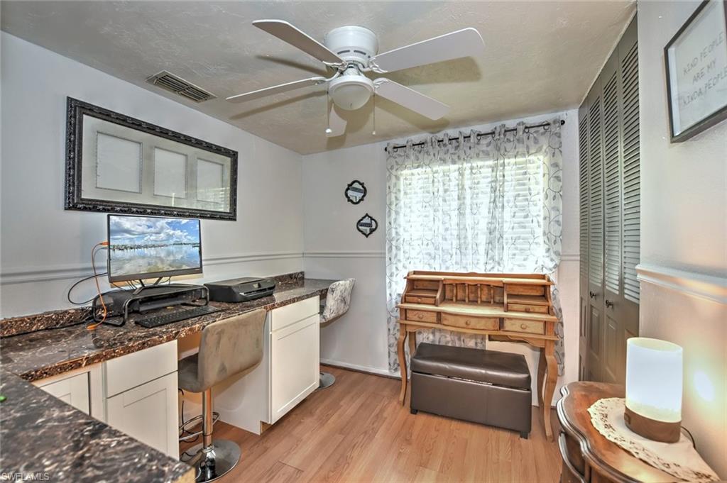 19066 Flamingo Road Fort Myers, FL 33967 - Photo 23 of 29 a kitchen with granite countertop a stove and a refrigerator