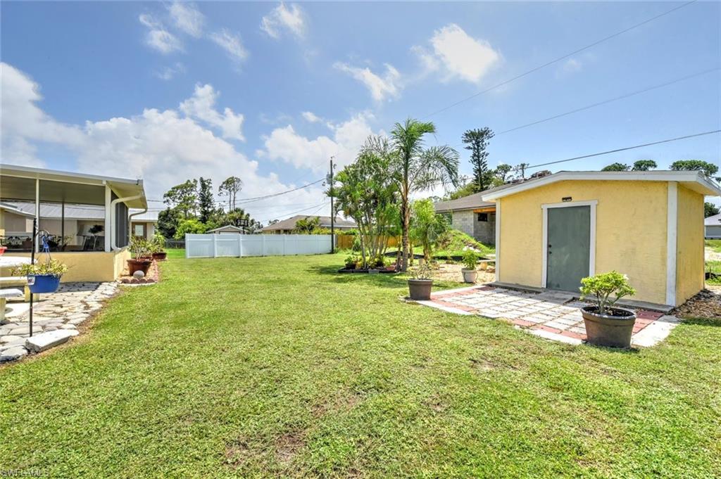 19066 Flamingo Road Fort Myers, FL 33967 - Photo 27 of 29 a front view of a house with garden