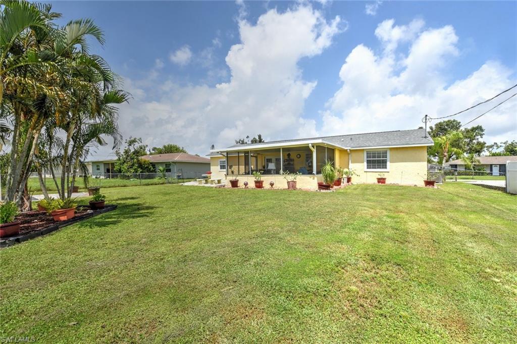 19066 Flamingo Road Fort Myers, FL 33967 - Photo 28 of 29 a view of house with a big yard