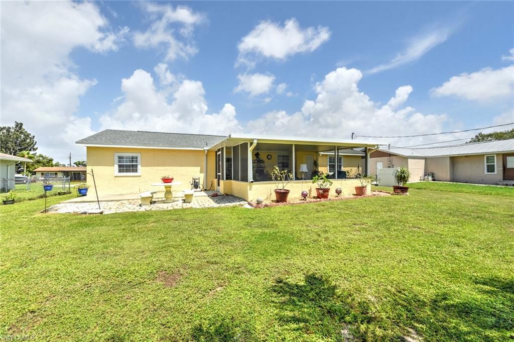 19066 Flamingo Road Fort Myers, FL 33967 - Photo 29 of 29 a front view of house with yard barbeque and outdoor seating