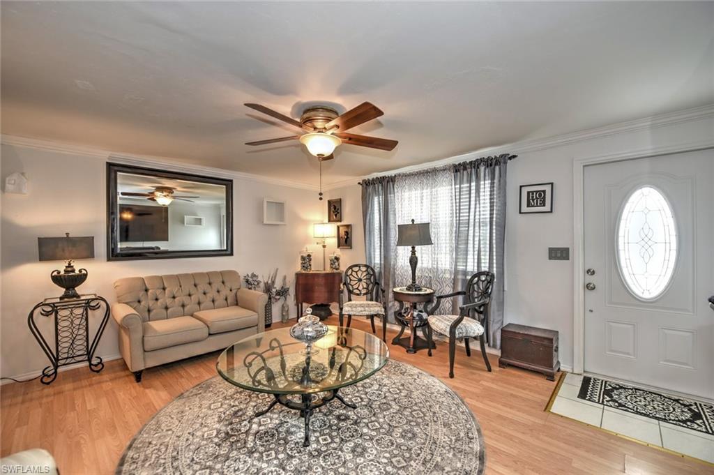 19066 Flamingo Road Fort Myers, FL 33967 - Photo 9 of 29 a living room with furniture and a large window