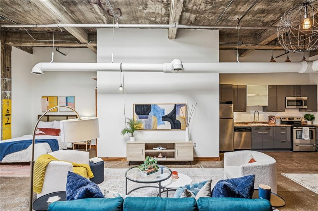 659 Auburn Avenue Northeast, Unit 229 Atlanta, GA 30312 - Photo 14 of 40 a living room with furniture and a kitchen