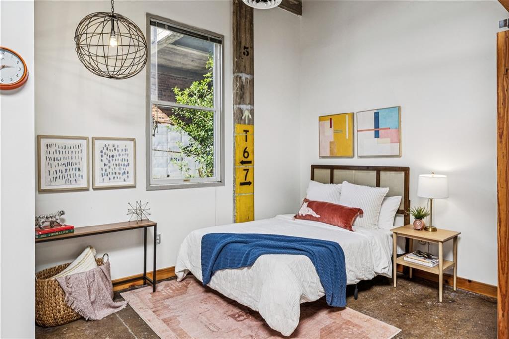 659 Auburn Avenue Northeast, Unit 229 Atlanta, GA 30312 - Photo 18 of 40 a bedroom with a bed and a window