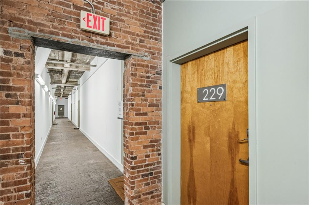 659 Auburn Avenue Northeast, Unit 229 Atlanta, GA 30312 - Photo 3 of 40 a view of a door with wooden walls