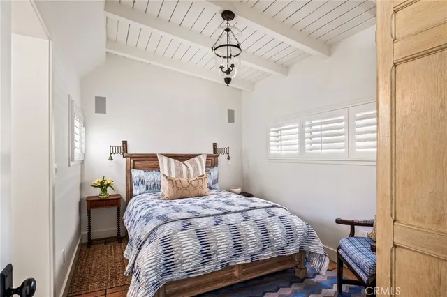 a bedroom with a bed and chair