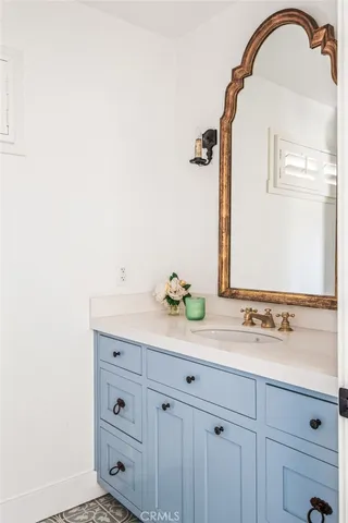a living room with a chair and a fireplace