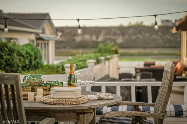 a view of balcony with a table and chairs