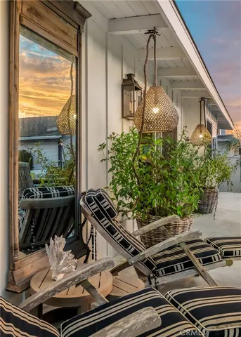 a view of a terrace with furniture and city view