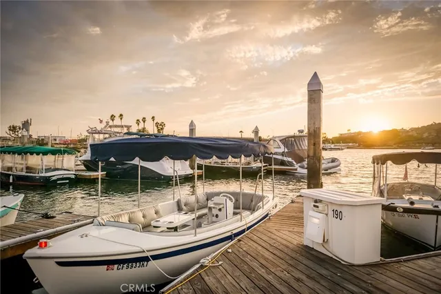 a view of a terrace with lawn chairs