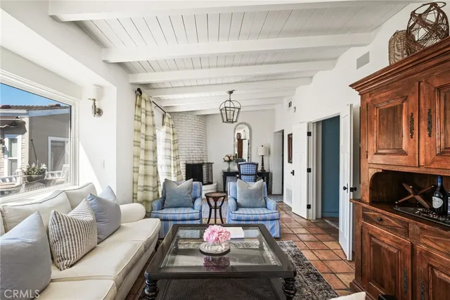 a living room with couch and a large window