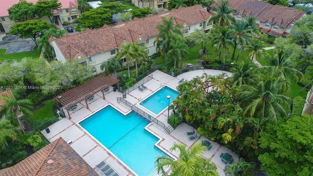 an aerial view of house with yard