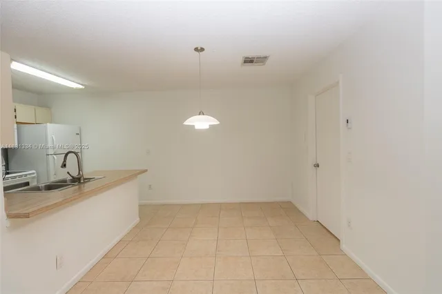 a view of a kitchen with a sink