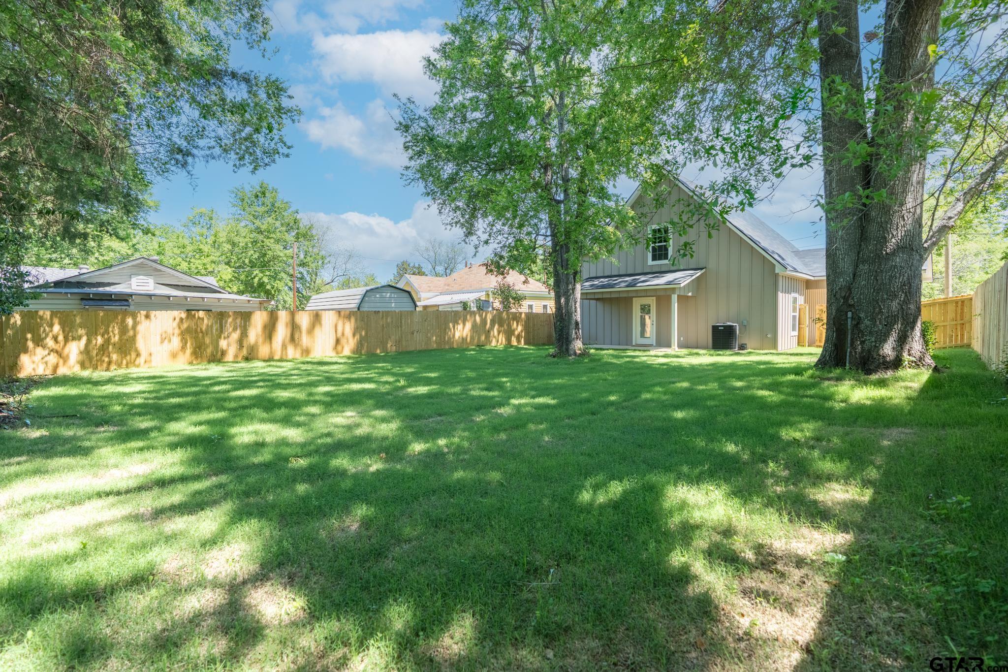 233 Harrison Street Longview, TX 75601 - Photo 38 of 44 a house with river in front of it