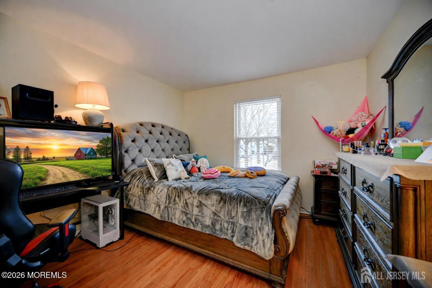 22 Borell Square Parlin, NJ 08859 - Photo 20 of 32 a bedroom with furniture and a flat screen tv