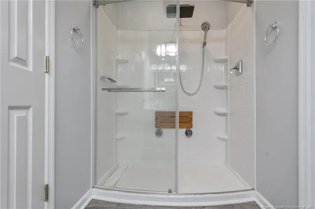 a bathroom with a glass shower door