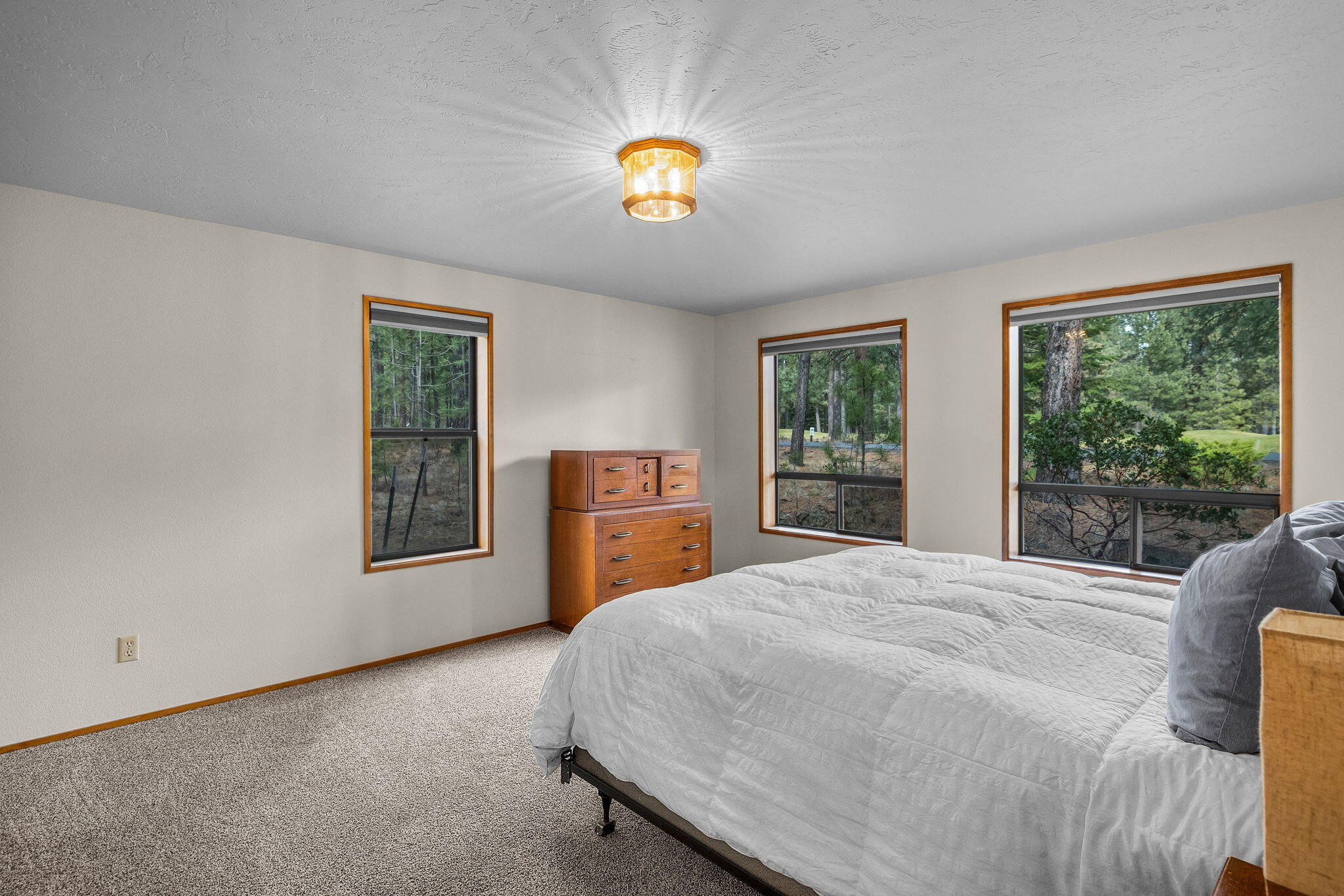 13168 Hawks Beard Black Butte Ranch, OR 97759 - Photo 11 of 47 a bedroom with a bed and a window