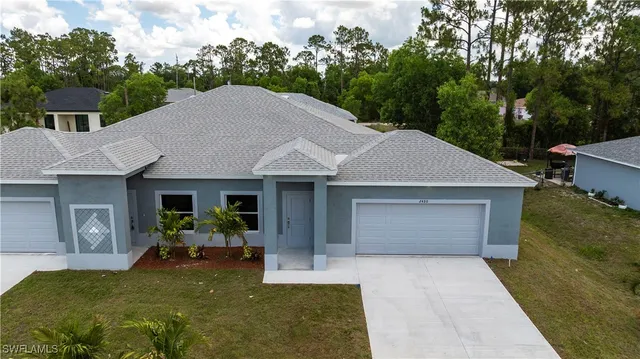 a view of kitchen with wooden floor and window
