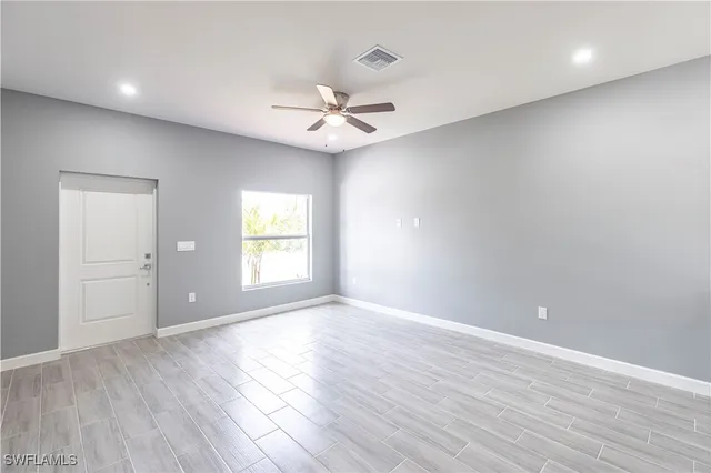 a view of a kitchen with marble kitchen and stainless steel appliances