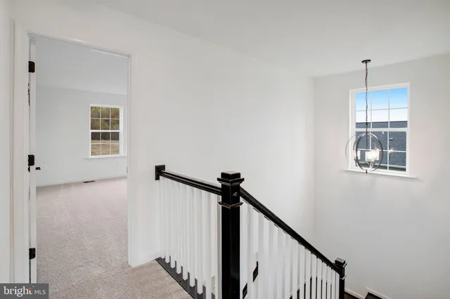 a view of a hallway with windows