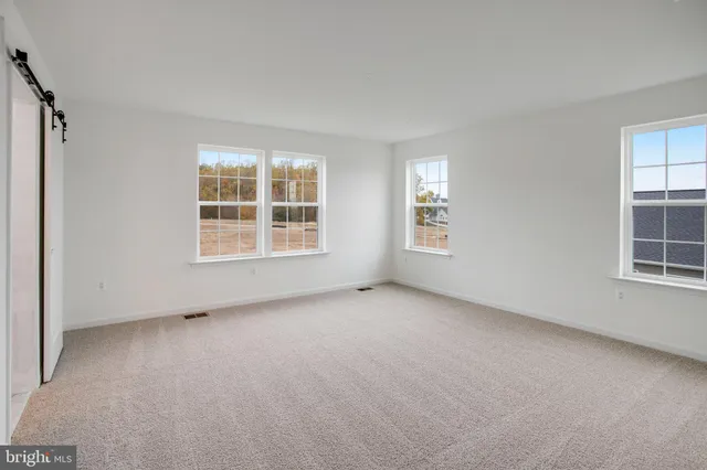 an empty room with windows