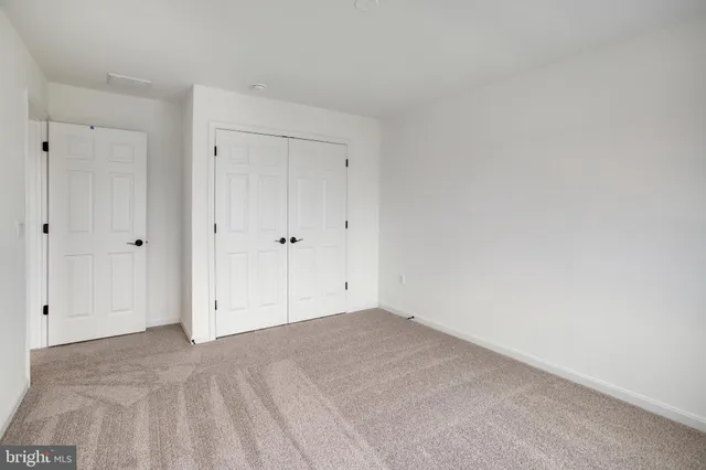 a bathroom with a sink a toilet a mirror and shower