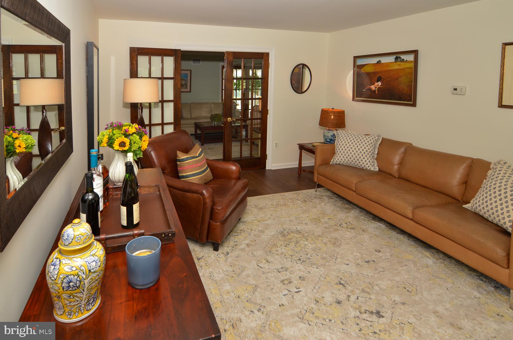 3 Aqua Terrace Hamilton, NJ 08620 - Photo 11 of 39 a living room with furniture and a floor to ceiling window