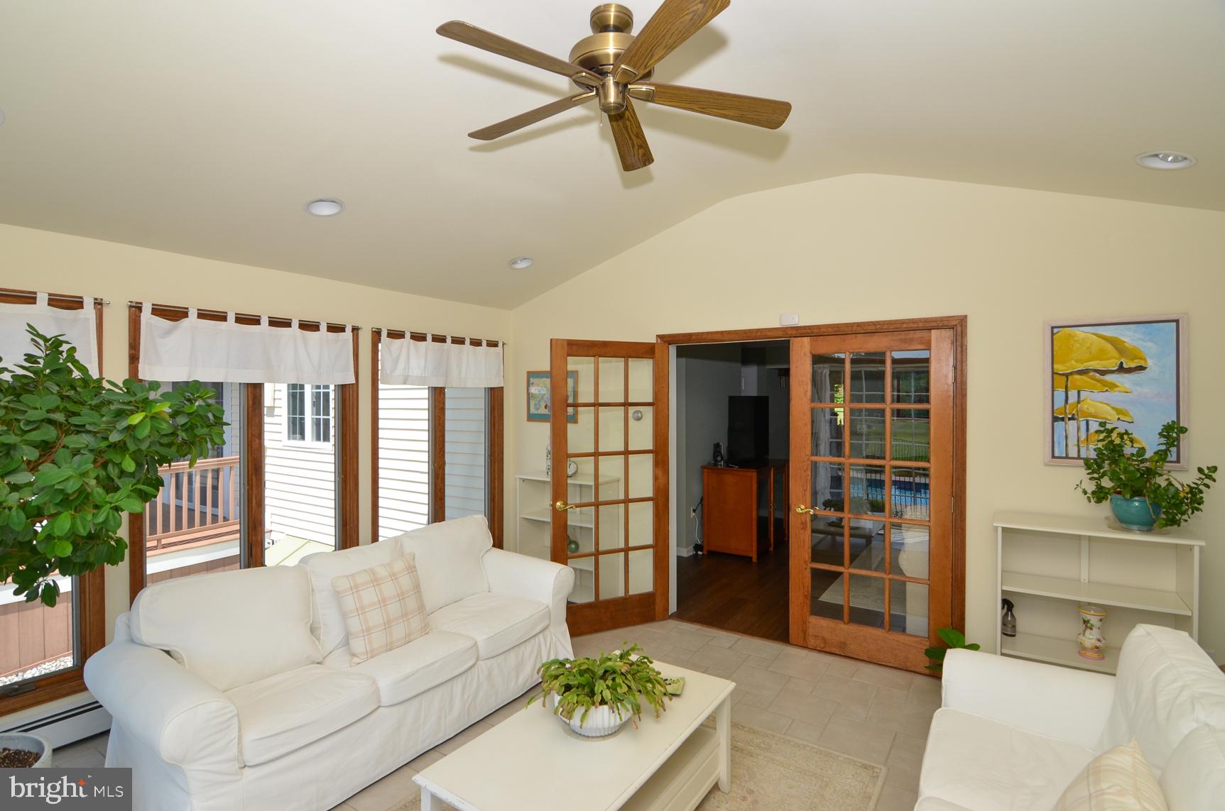 3 Aqua Terrace Hamilton, NJ 08620 - Photo 17 of 39 a living room with furniture and large window with potted plants