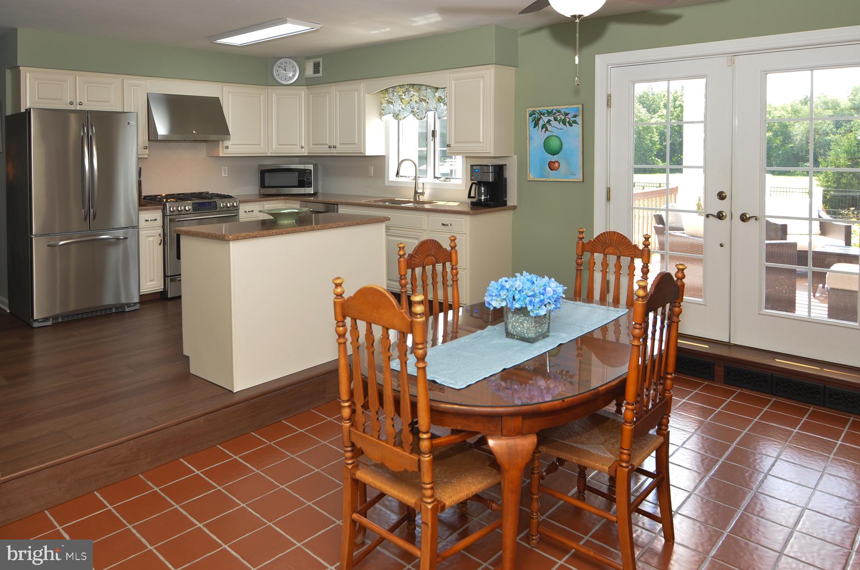 3 Aqua Terrace Hamilton, NJ 08620 - Photo 18 of 39 a dining room with furniture a window and stainless steel appliances