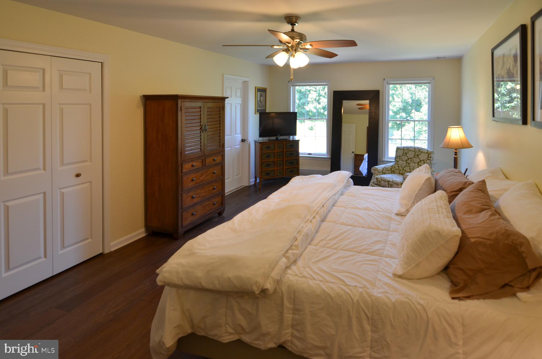 3 Aqua Terrace Hamilton, NJ 08620 - Photo 26 of 39 a large bedroom with a bed and a chandelier