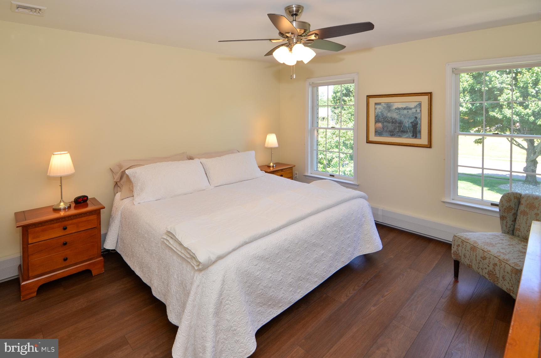 3 Aqua Terrace Hamilton, NJ 08620 - Photo 29 of 39 a bedroom with a bed and a chandelier